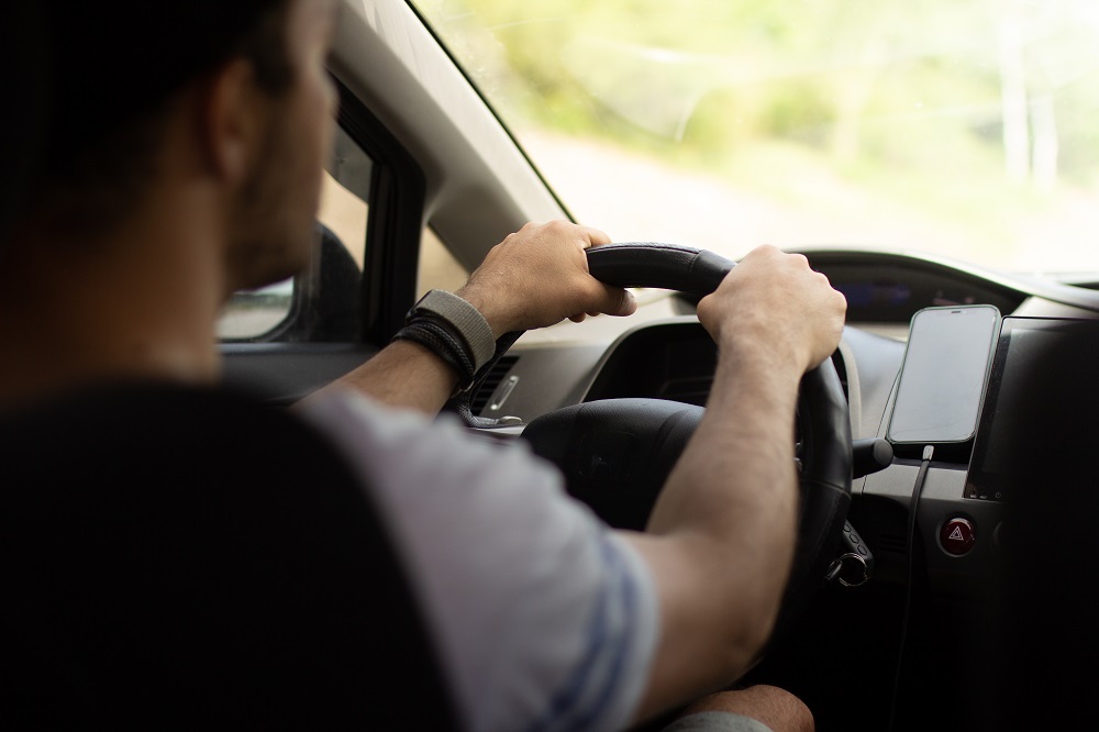 Driver travelling by car.